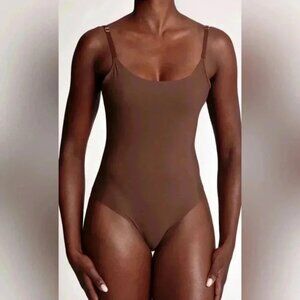 NWT  Nubian skin seamless lightweight spaghetti strap berry naked bodysuit S